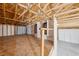 This is a garage with exposed framing, concrete flooring, and unfinished walls, ready for storage and projects at 3581 Mallard Ave, Pahrump, NV 89048