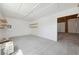 A bright garage has shelving and a doorway to the backyard, providing ample storage and easy access at 3581 Mallard Ave, Pahrump, NV 89048