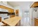 Kitchen boasts a center island, white appliances, and seamless access to the breakfast nook at 3581 Mallard Ave, Pahrump, NV 89048