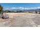 Large lot showcasing potential for expansion or development with mountain views in the background at 3581 Mallard Ave, Pahrump, NV 89048