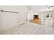 Open concept living space featuring tile flooring, a stone fireplace, and access to the backyard at 3581 Mallard Ave, Pahrump, NV 89048