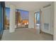 Open bedroom layout featuring a floor-to-ceiling window with stunning city views at 3726 Las Vegas Blvd # 1902, Las Vegas, NV 89158