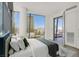 Bedroom with a view showcasing a large window with city views and a comfortable queen sized bed at 3726 Las Vegas Blvd # 1902, Las Vegas, NV 89158