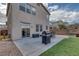 A lovely backyard with a patio, BBQ, and a patch of artificial turf perfect for outdoor activities at 3964 Irvin Ave, Las Vegas, NV 89141