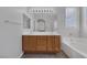 Luxurious bathroom featuring a double sink vanity, large mirror, and separate bathtub with a glass-enclosed shower at 3964 Irvin Ave, Las Vegas, NV 89141