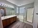 Bright bathroom with double sinks, separate tub, and glass enclosed shower at 3964 Irvin Ave, Las Vegas, NV 89141