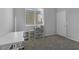 Bedroom featuring a window with blinds, neutral carpet and white door at 3964 Irvin Ave, Las Vegas, NV 89141