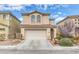 Two-story home featuring a two-car garage, low maintenance desert landscaping, and a neutral color palette at 3964 Irvin Ave, Las Vegas, NV 89141