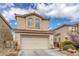 View of a two-story home with a two-car garage, desert landscaping, and a concrete driveway at 3964 Irvin Ave, Las Vegas, NV 89141