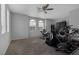 Spacious home gym with carpet, ceiling fan and natural light at 3964 Irvin Ave, Las Vegas, NV 89141