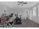 Home gym featuring neutral colored carpet, white walls, fan, and exercise equipment at 3964 Irvin Ave, Las Vegas, NV 89141