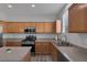 Modern kitchen features stainless steel appliances, light wood cabinetry, gray countertops and stainless steel sink at 3964 Irvin Ave, Las Vegas, NV 89141