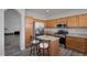 Kitchen featuring stainless steel appliances, light wood cabinetry, and seating at the island at 3964 Irvin Ave, Las Vegas, NV 89141