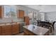 Open floor plan shows kitchen and dining area, featuring stainless steel appliances and seating for six at 3964 Irvin Ave, Las Vegas, NV 89141