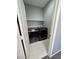 Modern laundry room featuring black, front-load washer and dryer at 3964 Irvin Ave, Las Vegas, NV 89141
