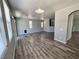 Bright living room with large windows, grey walls and hardwood floors at 3964 Irvin Ave, Las Vegas, NV 89141