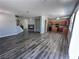 Spacious living room features hardwood floors, fireplace, and an open floor plan to the kitchen at 3964 Irvin Ave, Las Vegas, NV 89141