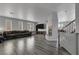 Large living room with wood-look floors, neutral paint, and a fireplace at 3964 Irvin Ave, Las Vegas, NV 89141