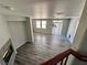 View from the top of the stairs to the living room with hardwood floors at 3964 Irvin Ave, Las Vegas, NV 89141