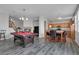 Large, open living space showcases a pool table and dining area near the kitchen at 3964 Irvin Ave, Las Vegas, NV 89141