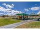 Community playground with covered picnic tables, swings, and slides for children to play and enjoy the outdoors at 3964 Irvin Ave, Las Vegas, NV 89141