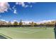 A fantastic community tennis court surrounded by lush trees and great lighting for fun recreational play at 3964 Irvin Ave, Las Vegas, NV 89141