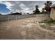 Spacious dirt backyard featuring a block wall with potential for various landscaping possibilities at 4189 Studio St, Las Vegas, NV 89115