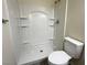 Bathroom featuring a walk-in shower and toilet with white finishes at 4189 Studio St, Las Vegas, NV 89115