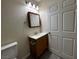 Bathroom featuring a toilet, vanity with sink, and medicine cabinet at 4189 Studio St, Las Vegas, NV 89115