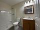 Bathroom with shower, toilet, and wood vanity with sink and medicine cabinet at 4189 Studio St, Las Vegas, NV 89115