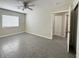 Spacious bedroom features gray tile flooring, a window, and a ceiling fan at 4189 Studio St, Las Vegas, NV 89115