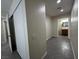 Hallway with gray tiled floor leading to the bathroom and closet at 4189 Studio St, Las Vegas, NV 89115