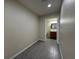 Hallway leading to a bathroom with a simple sink and mirror at 4189 Studio St, Las Vegas, NV 89115