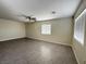 Bright living room showcasing tiled floors, ceiling fan, and natural lighting at 4189 Studio St, Las Vegas, NV 89115