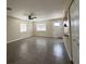 Open-concept living area features neutral tones and tile flooring for low maintenance and style at 4189 Studio St, Las Vegas, NV 89115