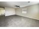 Bright living area offers tile flooring, ceiling fan, and an airy atmosphere at 4189 Studio St, Las Vegas, NV 89115