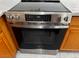 Close-up of a GE stainless steel oven with a sleek black glass top at 4189 Studio St, Las Vegas, NV 89115