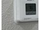 Close-up shot of a white Honeywell Home thermostat at 4189 Studio St, Las Vegas, NV 89115