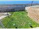 A private backyard features a grassy area, fence, and landscape lighting at 4437 Sherrill Ave, Las Vegas, NV 89110