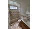 A cozy bathroom with ceramic tile, a standard toilet, and a single sink vanity at 4437 Sherrill Ave, Las Vegas, NV 89110
