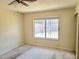 Cozy bedroom with carpet flooring, natural light, and a standard window at 4437 Sherrill Ave, Las Vegas, NV 89110