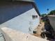 Exterior of the house with a side yard, fence, and shed at 4437 Sherrill Ave, Las Vegas, NV 89110