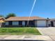 Charming single-story home featuring a well-maintained lawn and an attached one car garage at 4437 Sherrill Ave, Las Vegas, NV 89110
