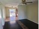 Comfortable living room showcasing hardwood flooring and views into the kitchen area at 4437 Sherrill Ave, Las Vegas, NV 89110