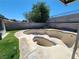 Empty pool in a backyard with privacy walls and some green grass at 4437 Sherrill Ave, Las Vegas, NV 89110