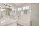 Bathroom featuring a tub, shower, double sink, and modern lighting at 4653 Califa Dr, Las Vegas, NV 89122