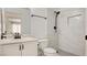Updated bathroom showcasing a new sink, toilet, and a beautifully tiled walk-in shower at 4653 Califa Dr, Las Vegas, NV 89122
