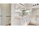 Bright bathroom with double sink vanity, large mirror, and updated fixtures at 4653 Califa Dr, Las Vegas, NV 89122