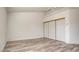 Spacious bedroom featuring wood-look flooring, a ceiling fan, and closet with sliding doors at 4653 Califa Dr, Las Vegas, NV 89122