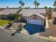 Aerial view of a well-maintained single-Gathering home with a two-car garage and desert landscaping at 4653 Califa Dr, Las Vegas, NV 89122